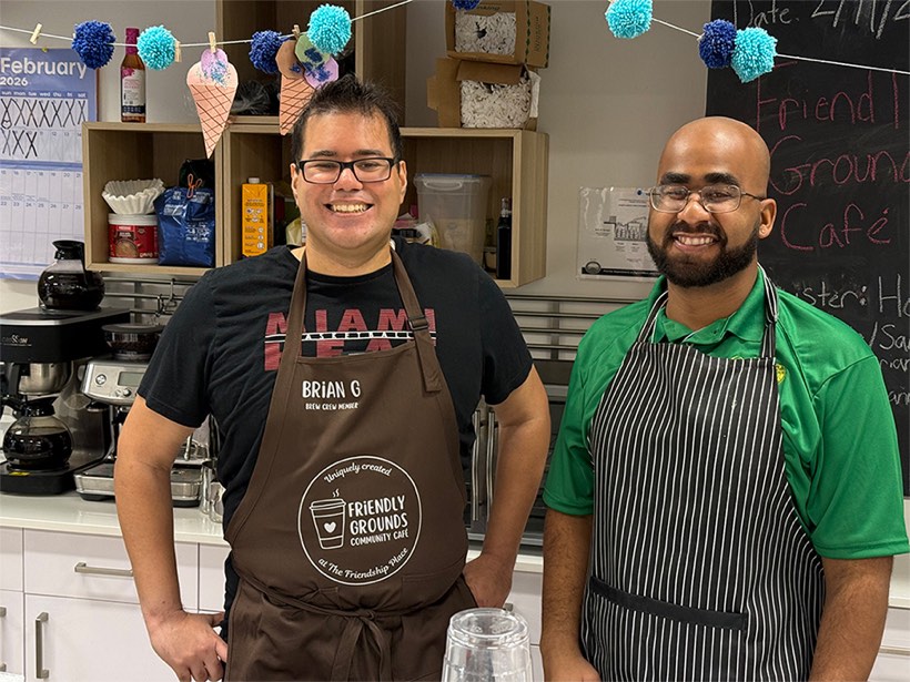 Friendly Grounds team members behind the café counter